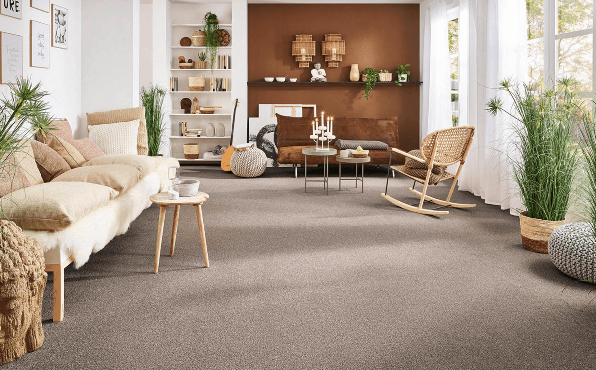 Cozy living room with beige carpet, sofa, rocking chair, and earthy decor accents.
