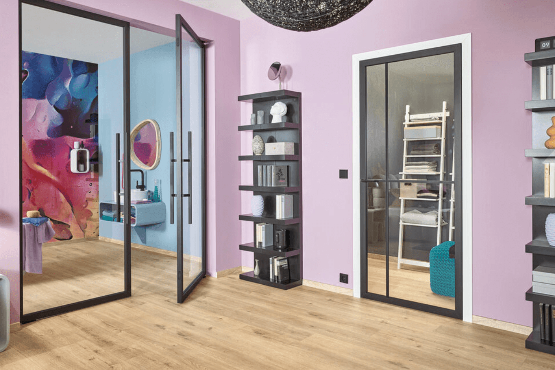 Modern room with pink walls, glass doors, and colorful abstract bathroom mural.